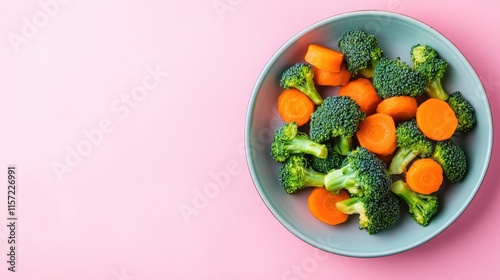 Fresh Broccoli and Carrot Medley on Pink Background Plate