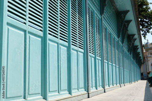 Light green antique wooden folding door wall at the ancient building.