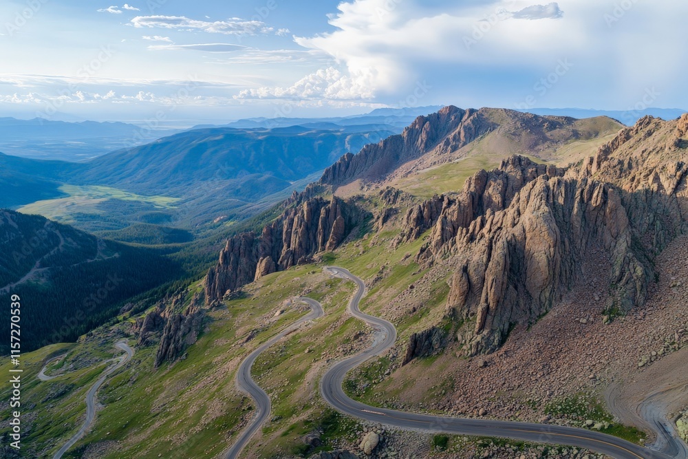 This image offers a breathtaking aerial view of a winding mountain road curving through expansive landscapes and rugged peaks, evoking a sense of adventure and exploration. This image offers a breathtaking aerial view of a winding mountain road curving through expansive landscapes and rugged peaks, evoking a sense of adventure and exploration.