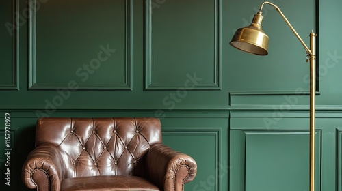 Elegant brown leather chair against rich green wall, paired with photo