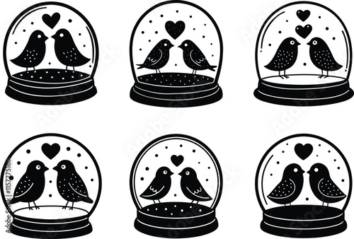 two lovebirds inside valentine themed snow globe