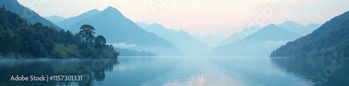 Serene mountain landscape with misty veil and peaceful lake surface, foggy mountains, stillness photo