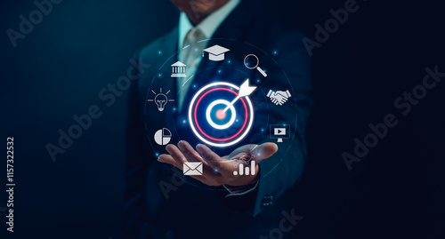 Goal and target concept ,Businessman show dart board and arrows on hand for setting business goals. Marketing solution Team goals for business ventures, planning for success photo