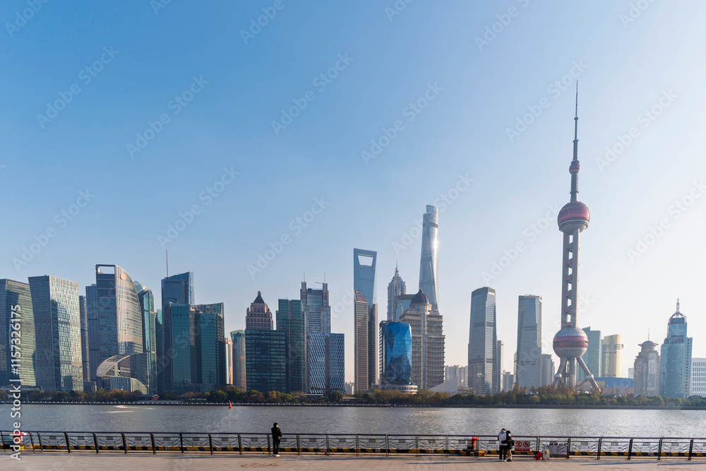 Shanghai city modern skyscraper cityscape in blue sky behind pollution haze, view from the North bund in Shanghai, China.