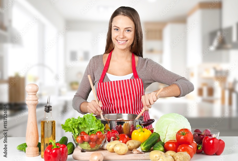 Portrait of beauty young woman cooking healthy food Portrait of beauty young woman cooking healthy food