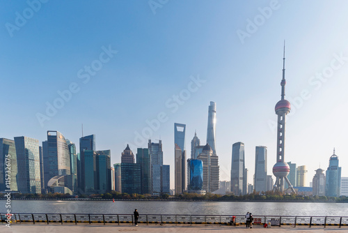 Obraz na płótnie Shanghai city modern skyscraper cityscape in blue sky behind pollution haze, view from the North bund in Shanghai, China. w salonie