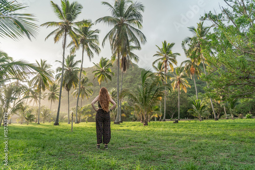 Woman between the palm trees. photo