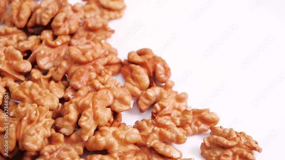 Walnut Halves Rotating on a White Background. Raw healthy ingredient Concept. Vegan Food