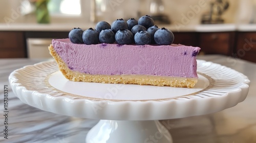 Homemade blueberry cheesecake slice elegantly presented on a cake stand showcasing its creamy texture and fresh fruit garnish photo