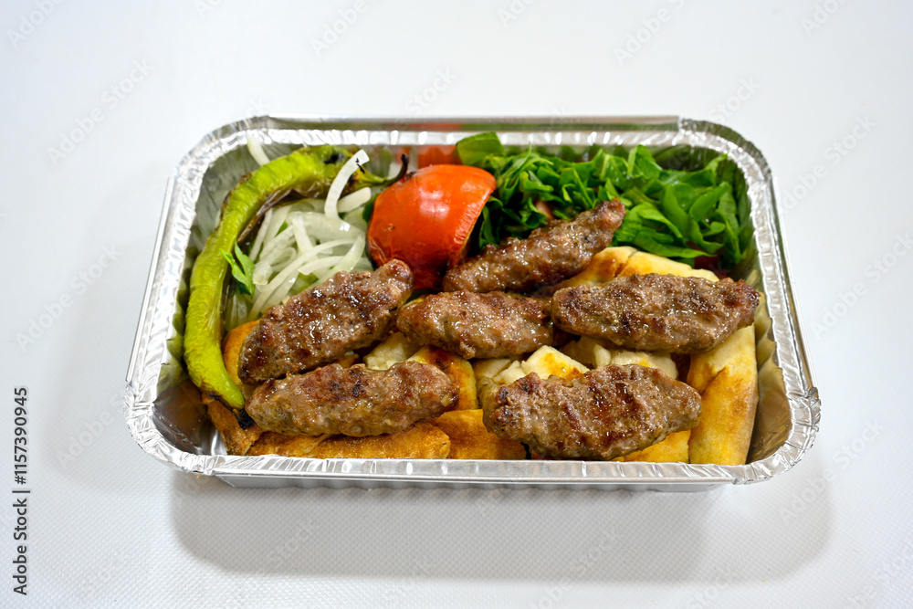 Meatball between bread (Turkish name : ekmek arasi kofte ) Izgara kofte. Manisa, Akcaabat, Akhisar kofte. Delicious meat grilled meatballs. Meatball between bread (Turkish name : ekmek arasi kofte ) Izgara kofte. Manisa, Akcaabat, Akhisar kofte. Delicious meat grilled meatballs.