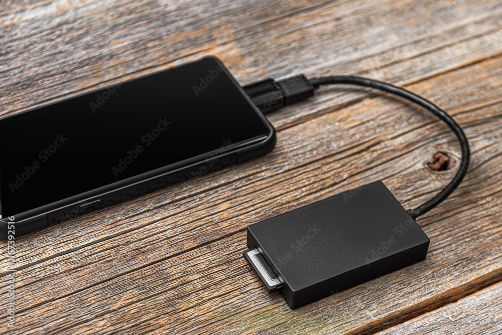 The card reader is connected to a mobile device: phone or tablet.