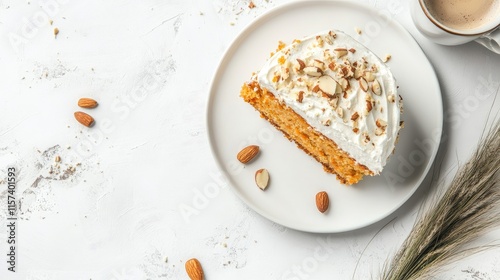 Homemade carrot cake slice topped with cream and almonds alongside a coffee cup on a textured white background horizontal view photo