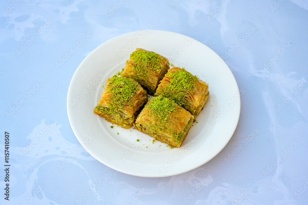 Turkish Dessert Sobiyet, havuc dilimi, midye baklava, mussels baklava and classic baklava with Pistachio . Cikolatali cevizli, fistikli soguk Baklava, top view.