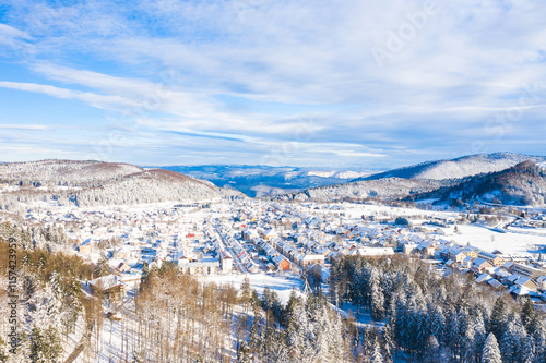 Drone aerial view of the town of Delnice in Gorski kotar in winter under snow, Croatia photo