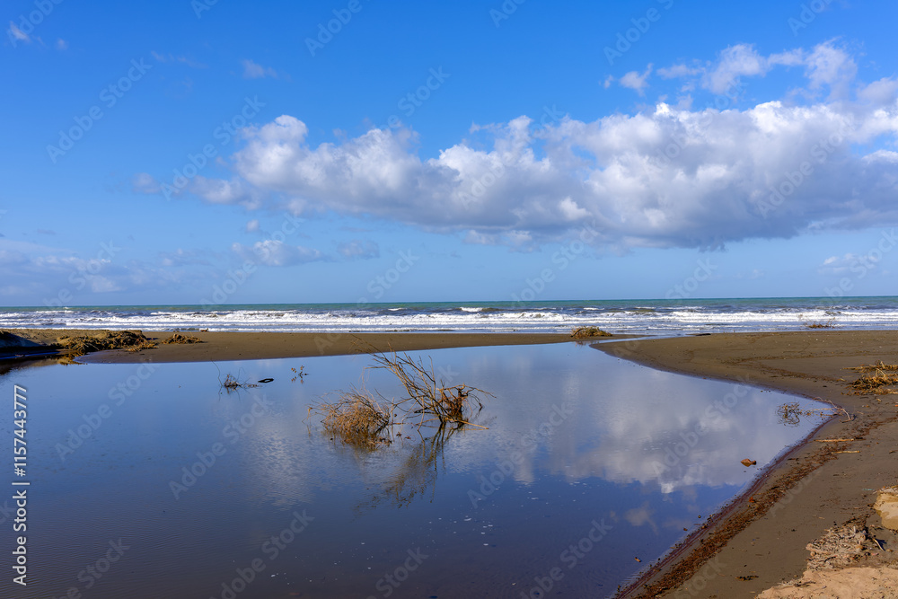 Seascape on a particularly cloudy day of Pianetti beach in Castagneto Carducci Tuscany Italy Seascape on a particularly cloudy day of Pianetti beach in Castagneto Carducci Tuscany Italy