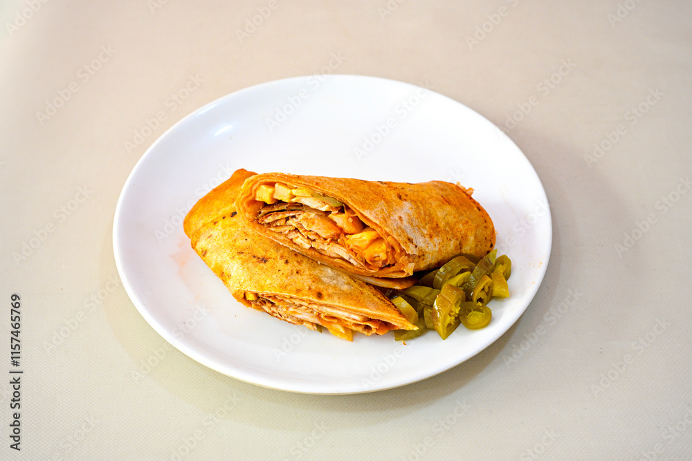 Lavash doner kebab ( soslu kasarli zurna doner durum ) or shawarma sliced in plate isolated. Tavuk Et Doner Durum. Hatay Iskenderun usulu bazuka tavuk doner durum. Lavash doner kebab ( soslu kasarli zurna doner durum ) or shawarma sliced in plate isolated. Tavuk Et Doner Durum. Hatay Iskenderun usulu bazuka tavuk doner durum.