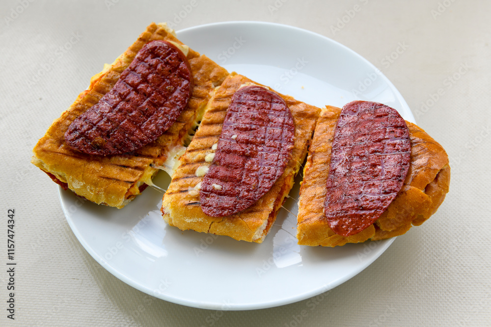 Turkish karisik atom kare tost ( kasarli bazlama tost) . Sucuklu, Kasarli, cheddarli, kavurmali karisik tost. Flat baked bread toasted. Karisik bazlama tost . Turkish karisik atom kare tost ( kasarli bazlama tost) . Sucuklu, Kasarli, cheddarli, kavurmali karisik tost. Flat baked bread toasted. Karisik bazlama tost .