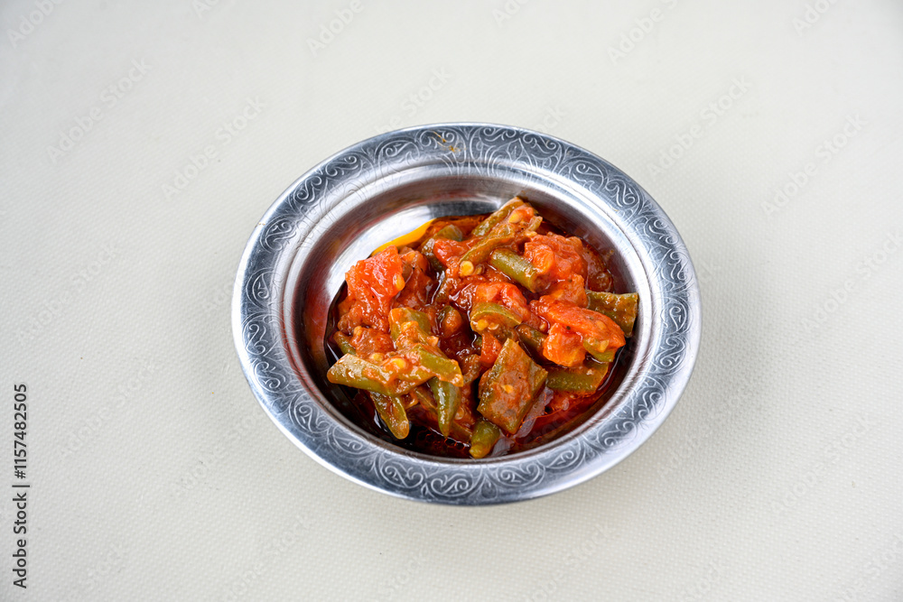 A spicy Turkish appetizer ezme made with tomatoes, bell pepper, parsley, mint, olive oil and hot chili. A kind of adjika. Kahvaltilik acuka, Antep usulu acili ezme. Acili Biber borani. A spicy Turkish appetizer ezme made with tomatoes, bell pepper, parsley, mint, olive oil and hot chili. A kind of adjika. Kahvaltilik acuka, Antep usulu acili ezme. Acili Biber borani.
