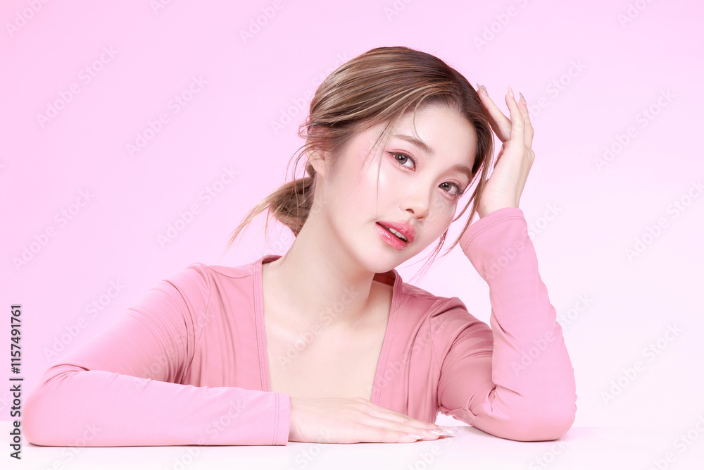 Portrait of a Smiling Asian Woman fresh skin in Stylish Pink Attire Against a Soft Background. Portrait of a Smiling Asian Woman fresh skin in Stylish Pink Attire Against a Soft Background.