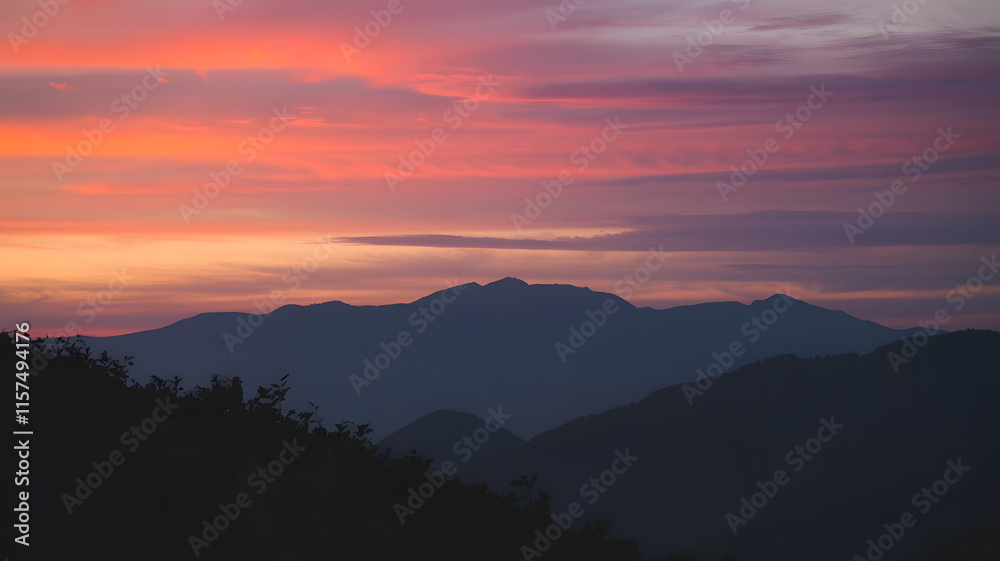 Obraz premium A photo of a mountainous landscape during sunset.