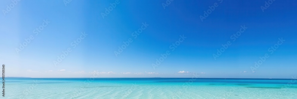 Stunning panoramic view of a serene turquoise ocean blending seamlessly into a clear blue sky with soft white clouds in a tranquil tropical paradise setting.