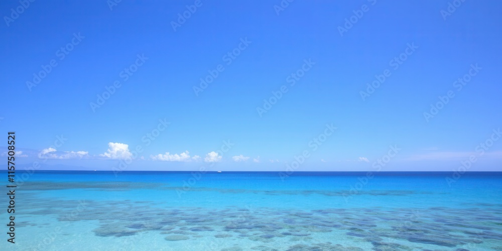 Fototapeta premium Serene Coastal Landscape Featuring Crystal Clear Water and Vibrant Blue Sky, Ideal for Travel, Vacation, and Nature Themes in Stock Photography Collections