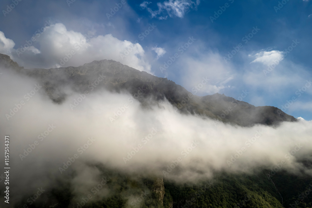 Mountains in the clouds. Low clouds in the North Caucasus mountains Mountains in the clouds. Low clouds in the North Caucasus mountains