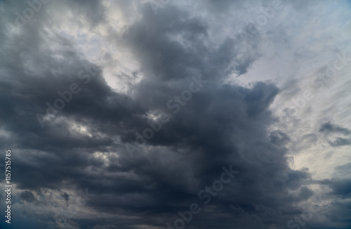 Fototapeta Naklejka Na Ścianę i Meble -  Gloomy clouds covering the sky symbolize winter overcast and chill.