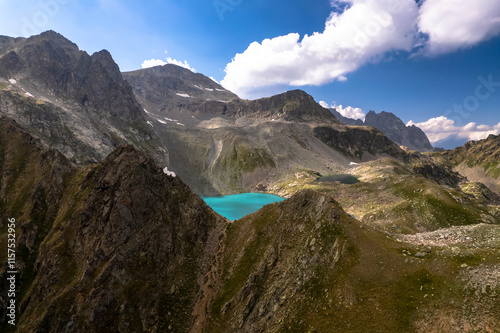 Mountain lake with blue water in a picturesque gorge. Landscape and nature of the North Caucasus