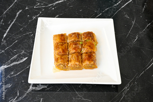 Turkish Dessert Sobiyet, havuc dilimi, midye baklava, mussels baklava and classic baklava with Pistachio . Cikolatali cevizli, fistikli soguk Baklava, top view. photo