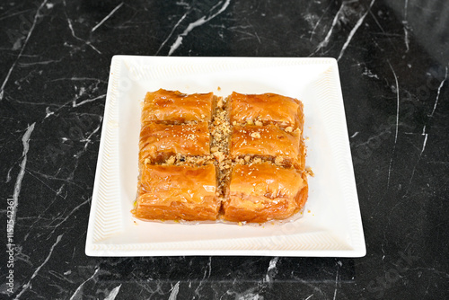 Turkish Dessert Sobiyet, havuc dilimi, midye baklava, mussels baklava and classic baklava with Pistachio . Cikolatali cevizli, fistikli soguk Baklava, top view. photo