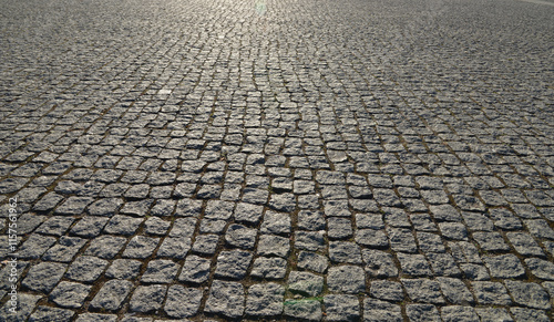 Old cobblestone pavement close-up photo