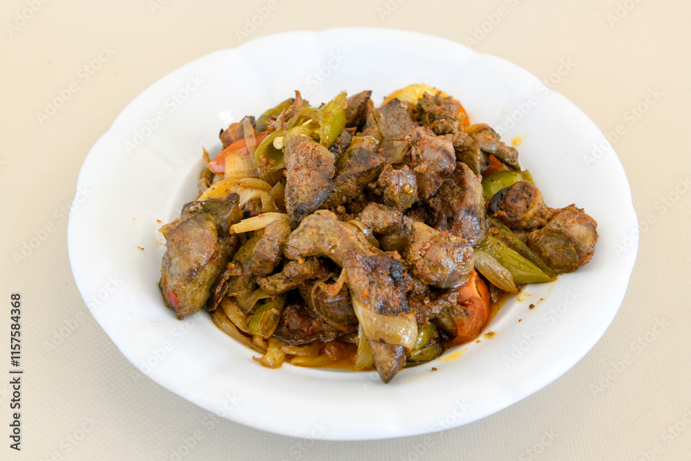 Famous Urfa meat liver, ciger wrapped by lavash with roasted chili pepper, onion and sauce in Sanliurfa, Turkey. Kuzu et ciger sis. Izgara dana bonfile, cop sis, kuzu pirzola. Karisik kebap, beyti keb