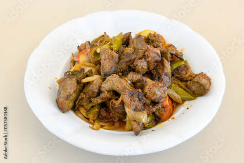 Famous Urfa meat liver, ciger wrapped by lavash with roasted chili pepper, onion and sauce in Sanliurfa, Turkey. Kuzu et ciger sis. Izgara dana bonfile, cop sis, kuzu pirzola. Karisik kebap, beyti keb photo