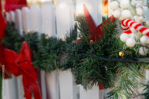 christmas tree decorations. White fence with christmas decoration.