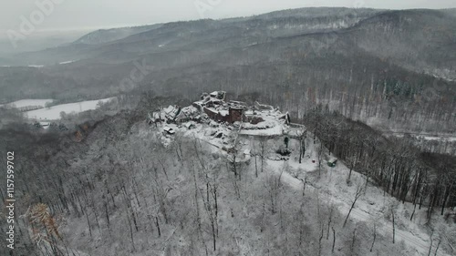 Aerial view ruins of old castle. Winter. Ruin of Hohnstein Castle, Harz mountains, Germany.