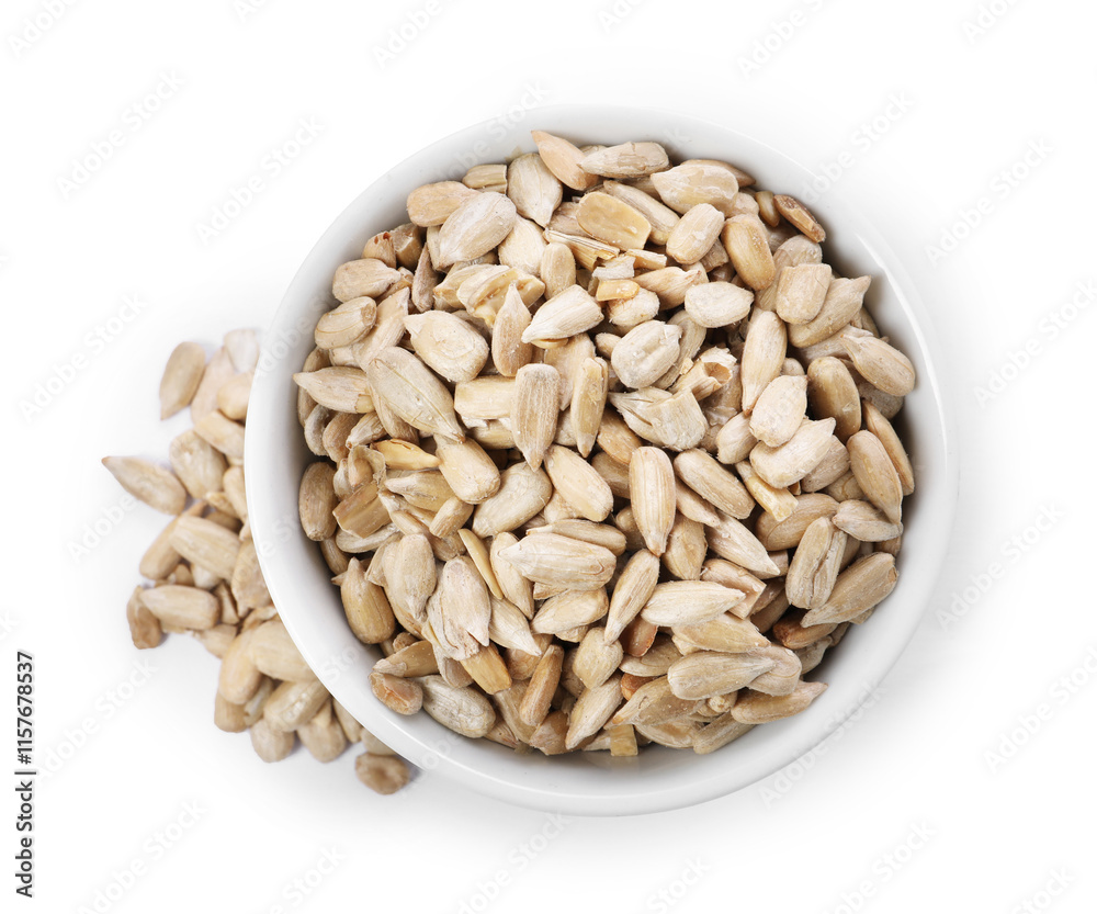 Peeled sunflower seeds in bowl isolated on white, top view Peeled sunflower seeds in bowl isolated on white, top view