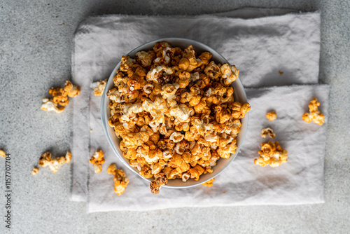 Top view of sweet caramel popcorn in a bowl photo