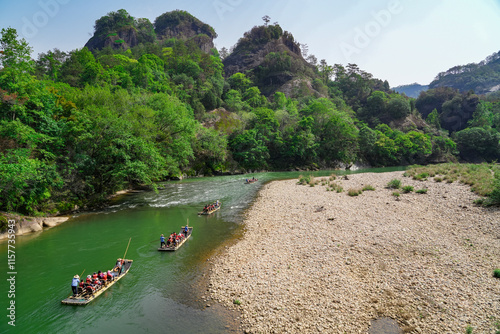 landscape of bamboo raft in the river with tourist photo