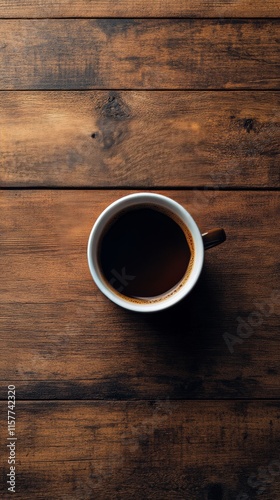 Coffee cup with brown liquid and coffee beans on wooden surface at cozy cafe