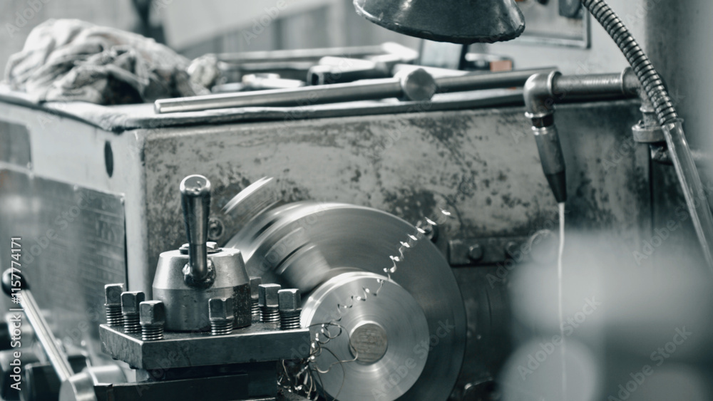 Metalworking lathe cutting a metal part, producing swarf, in an industrial workshop, showcasing the precision and power of modern machining processes Metalworking lathe cutting a metal part, producing swarf, in an industrial workshop, showcasing the precision and power of modern machining processes