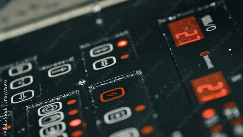 Close up view of a control panel displaying temperature readings and various settings, with red lights illuminating specific buttons, indicating active functions or selected options Close up view of a control panel displaying temperature readings and various settings, with red lights illuminating specific buttons, indicating active functions or selected options