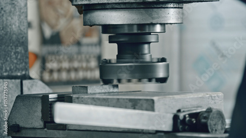 Fotografija Close up of a powerful industrial stamping machine pressing a metal workpiece, s