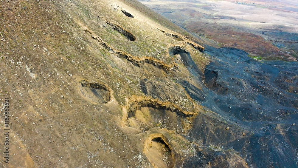 Obraz premium Aerial view of the ancient volcanic fumaroles of the Gairia Caldera, in Fuerteventura, Spain.