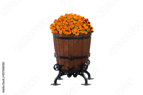 Bright orange flowers fill a decorative wooden barrel planter set on an iron stand