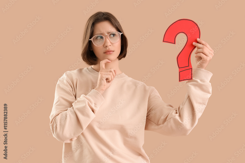 Thoughtful young woman with paper question mark on beige background Thoughtful young woman with paper question mark on beige background
