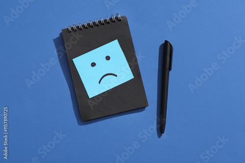 Notebook and pen with drawn...