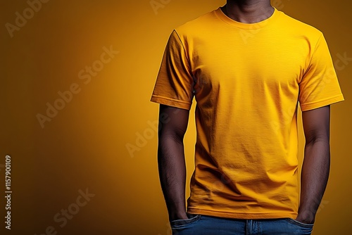 A Man Wearing A Yellow T Shirt And Jeans