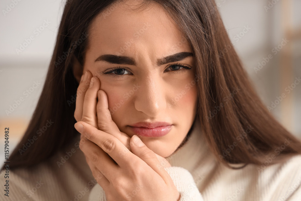 Young woman suffering from toothache at home, closeup Young woman suffering from toothache at home, closeup