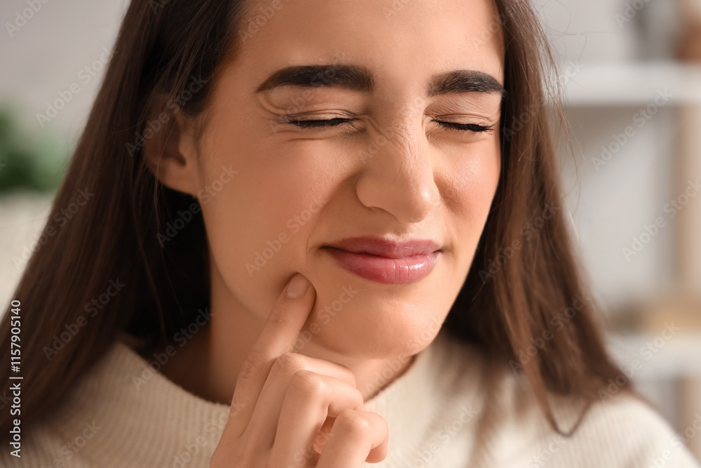 Young woman suffering from toothache at home, closeup Young woman suffering from toothache at home, closeup